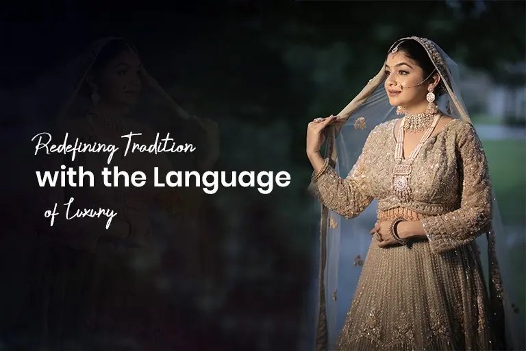 Elegant woman dressed in a beige saree sitting on a classic traditional chair with soft light